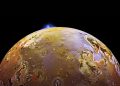 Synchronised volcanic eruptions on Io hint at a spongy interior