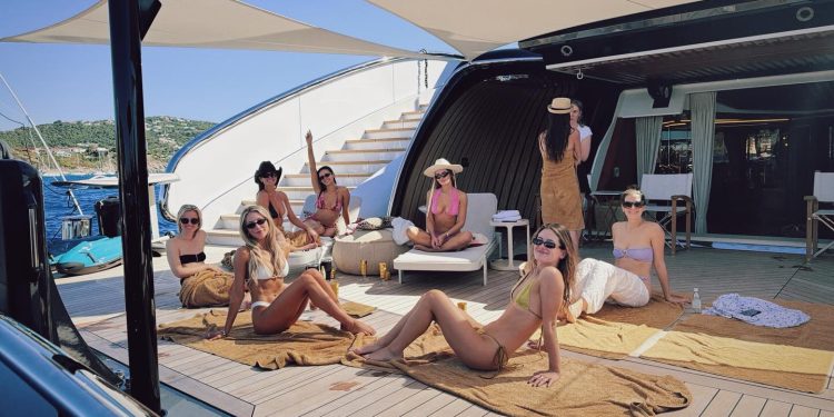 Alix Earle cozies up to Tom Brady at St. Barts yacht party after Braxton Berrios breakup