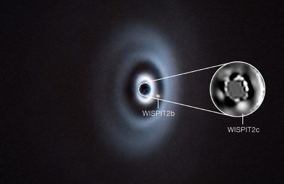Two Protoplanets Emerge from Dusty Disk around Nearby Young Star