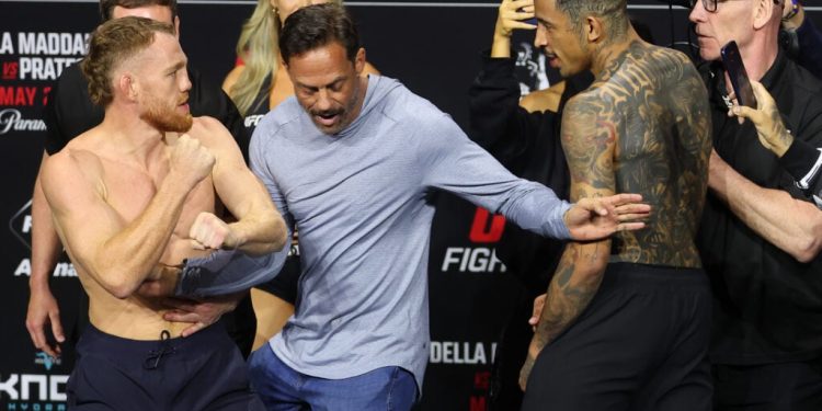 Carlos Prates held back as he tries to get at Jack Della Maddalena in heated face off: ‘Why you scared?’