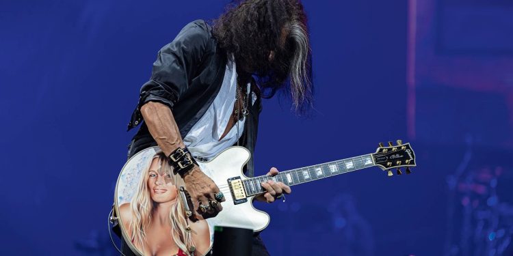 “She had no idea this was going on. They came out with this guitar case and said, ‘Close your eyes.’ We opened it up, and she turned beet red”: Joe Perry on how the most romantic thing he has ever done involved a custom-painted guitar