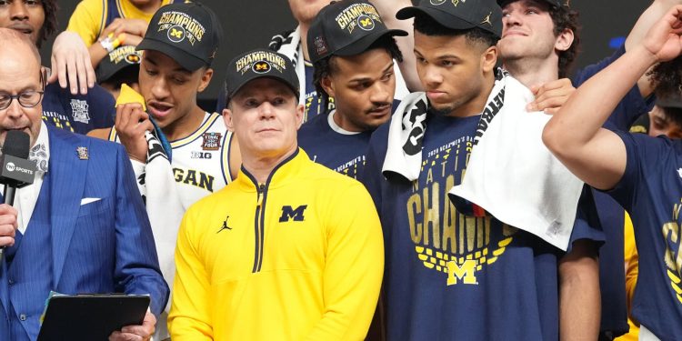 Mavericks hiring Dusty May away from Michigan in basketball stunner