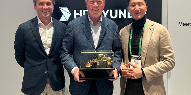 Kisun Chung, Vice Chairman of HD Hyundai, Presents A Golden Loader Award to NED Top Executives During CES Show in Las Vegas