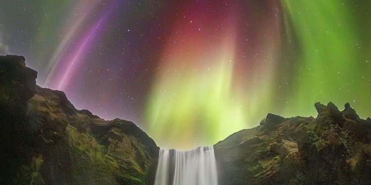 APOD: 2026 August 27 – Colorful Aurora over an Icelandic Waterfall