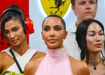 Forget Ferrari Red: Kim Kardashian Pulls up to the Paddock in Pastel Pink