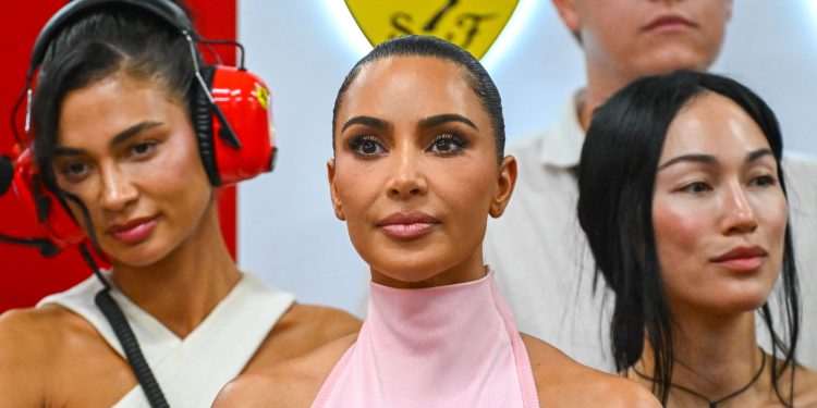 Forget Ferrari Red: Kim Kardashian Pulls up to the Paddock in Pastel Pink